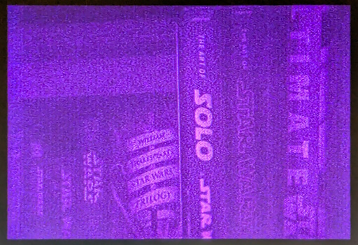 A discolored capture of a bookshelf